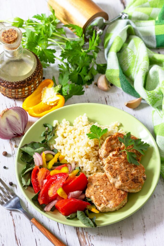 Healthy vegan food, keto or paleo diets. Homemade red fish cutlets with bulgur.